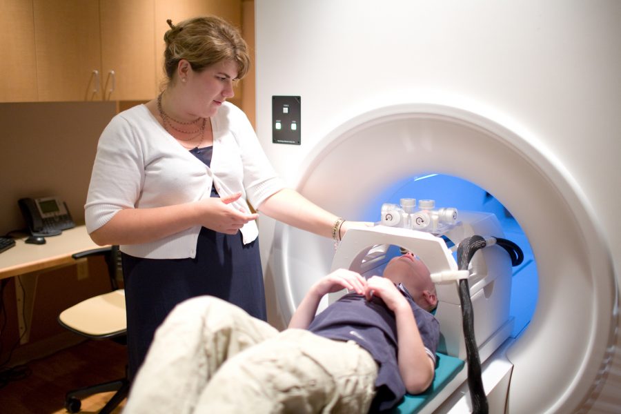 doctor with patient in mri