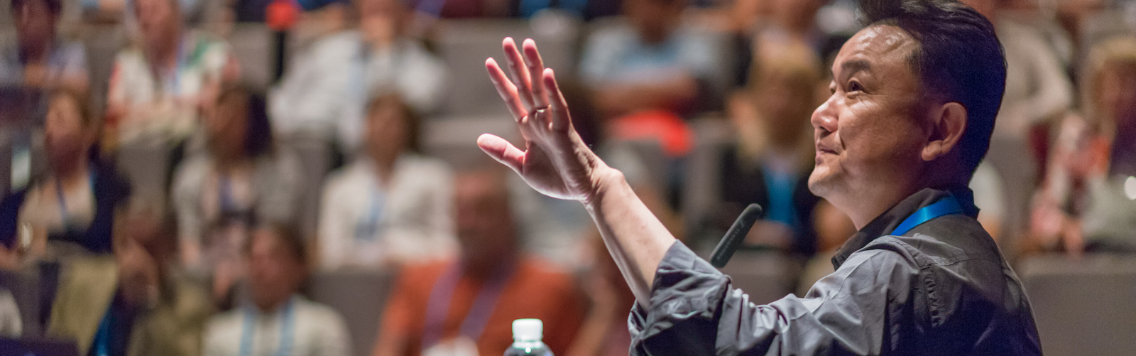 Speaker giving a talk at conference